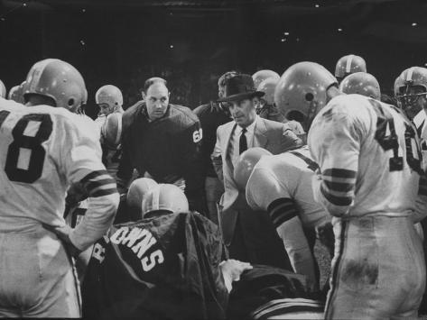coach-paul-brown-speaking-to-the-cleveland-browns-football-team-from-the-middle-of-the-huddle.jpg