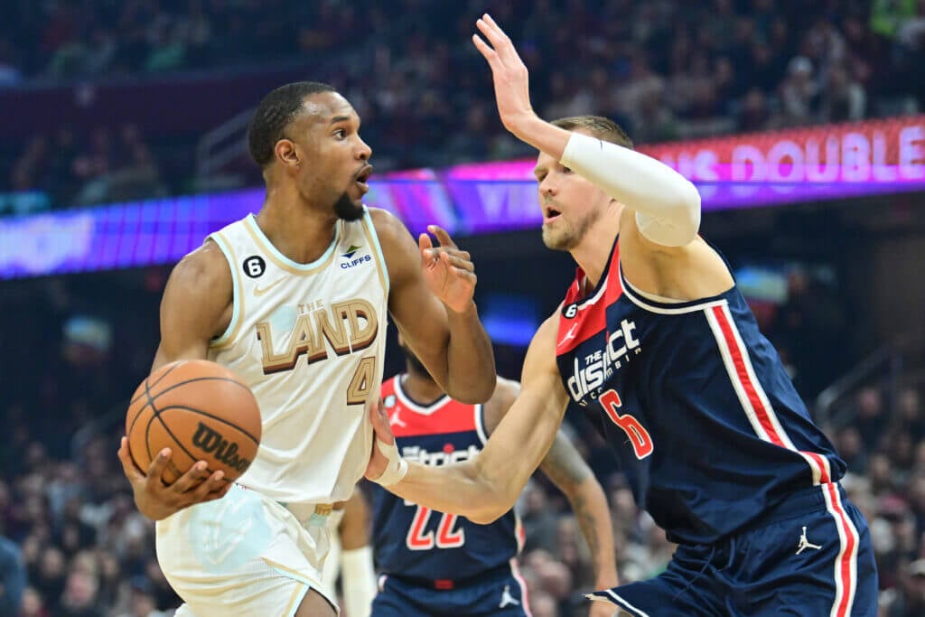 Mar 17, 2023; Cleveland, Ohio, USA; Cleveland Cavaliers forward Evan Mobley (4) drives to the basket against Washington Wizards center Kristaps Porzingis (6) during the first half at Rocket Mortgage FieldHouse. Mandatory Credit: Ken Blaze-USA TODAY Sports